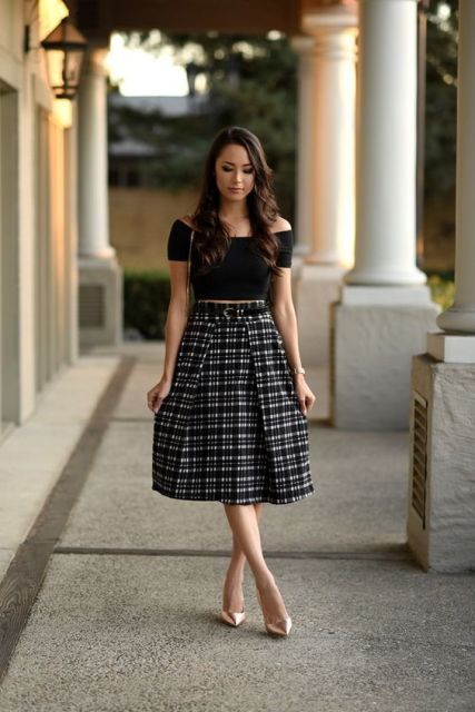 Look with black crop top and checked A-line skirt
