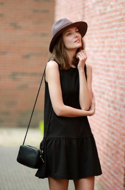 Look with black drop waist dress, mini bag and hat