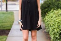 Look with black mini halter dress and heels
