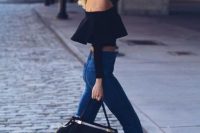 Look with black ruffle top and flare jeans