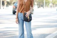 Look with cropped flared jeans, lace up heels and v neckline top