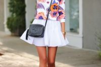 Look with floral sweatshirt, white skirt and heels