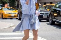 Look with mini denim shirtdress and bright clutch