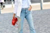 Outfit with flare jeans, white elongated jacket and heels