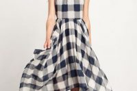 Plaid halter dress with sandals and oversized sunglasses