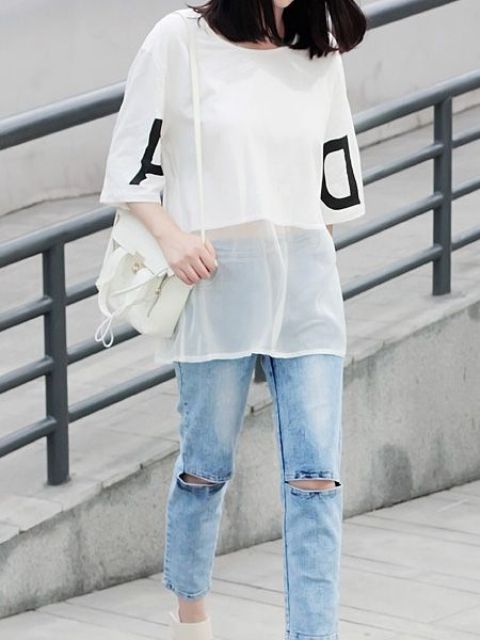 Trendy outfit with white sheer shirt and distressed jeans