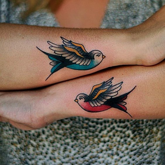 matching swallow birds tattoos