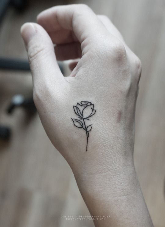 black rose on a hand