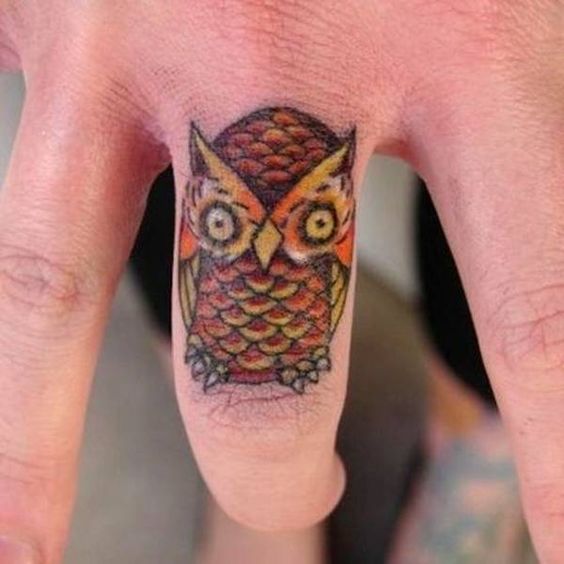 colorful owl hand tattoo
