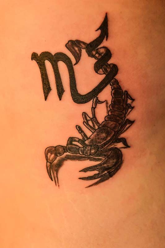 Zodiac sign combined with a scorpio tattoo