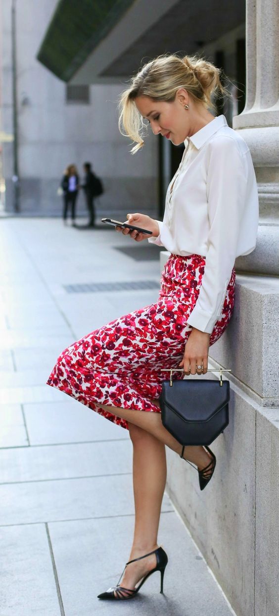 a white blouse, a floral pencil skirt and black heels