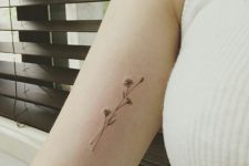 05 tiny wildflower arm tattoo