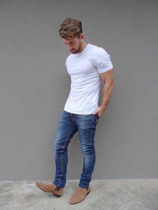 blue jeans, a white tee and tan suede shoes