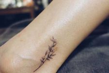 09 tiny ankle black flower tattoo