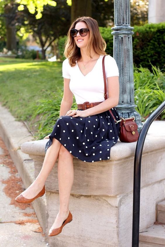 10 a polka dot skirt, a white top and tan flats