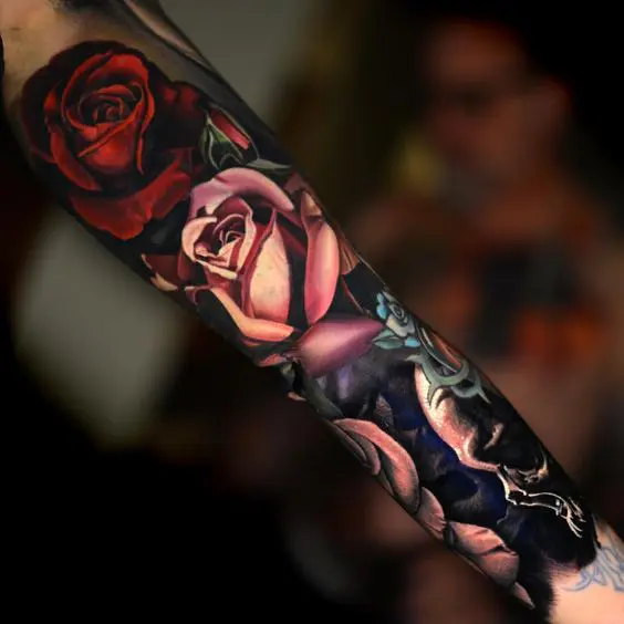realistic moody floral tattoo sleeve
