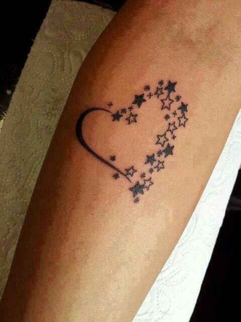 stars in a heart shape on an arm