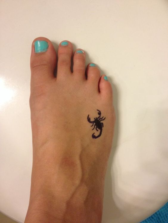 tiny scorpion foot tattoo