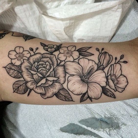 black and grey peony flower arm tattoo