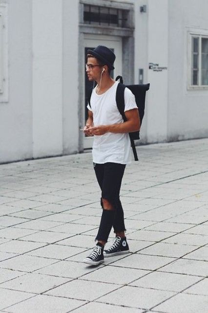 distressed black denim, a white tee and black sneakers