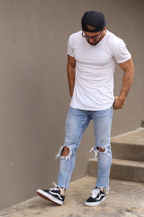light blue distressed jeans, a white t-shirt and black sneakers