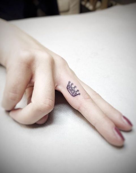 side of finger is a great place for a small tattoo