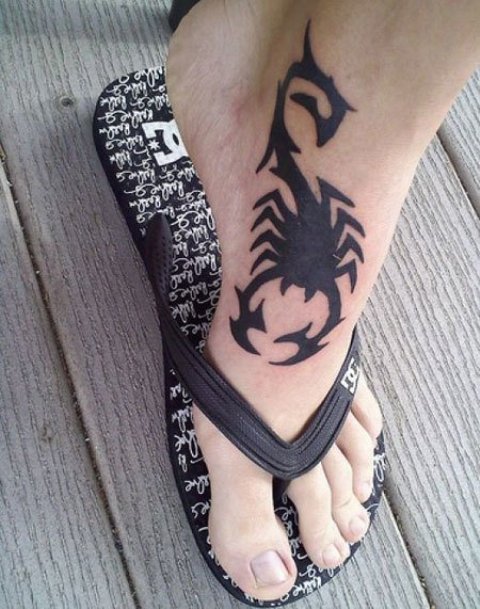 black geometric foot tattoo