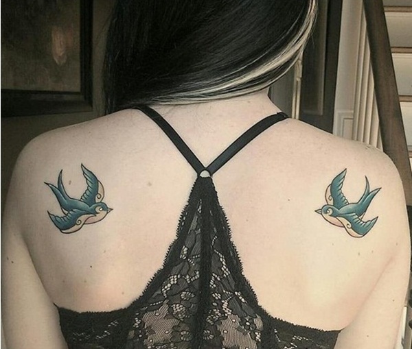 double colorful bird tattoos on the shoulders