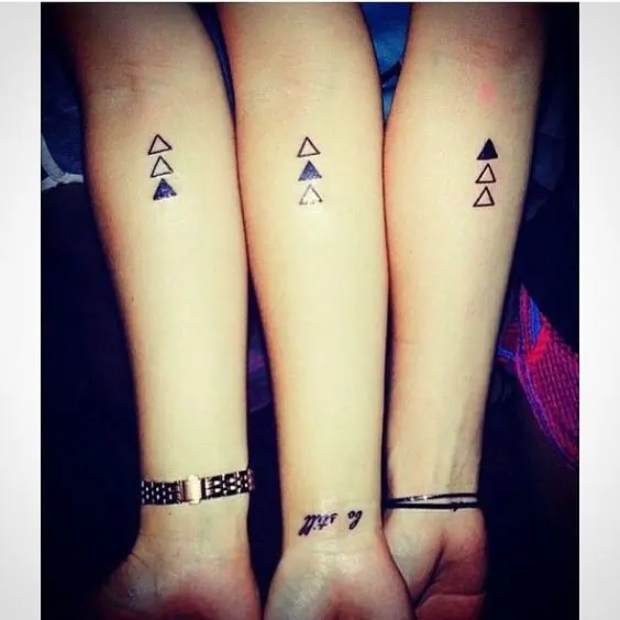 creative tirangle arm tattoos for three persons