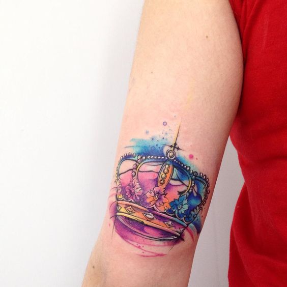 watercolor arm crown tattoo