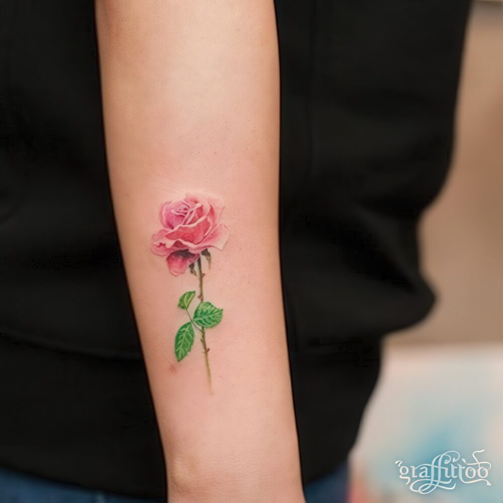 22 subtle tiny rose on an arm