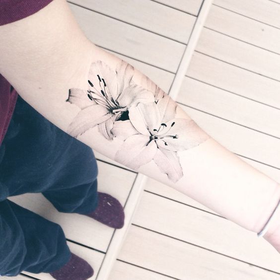 realistic lily tattoo with a black and white outline