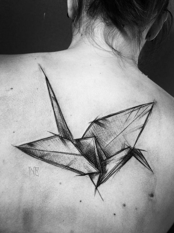 origami flying bird tattoo on the back