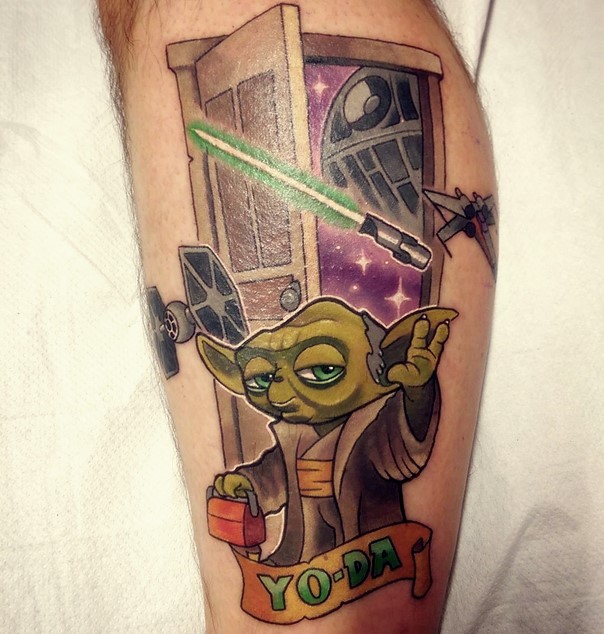humorous colorful Yoda and lightsaber tattoo