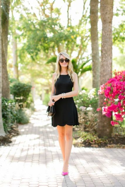 Black cocktail dress with pink pumps