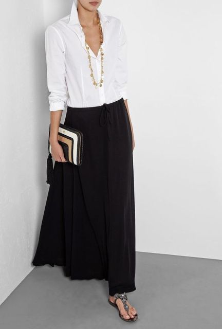 Chic look with black maxi skirt and classic white shirt
