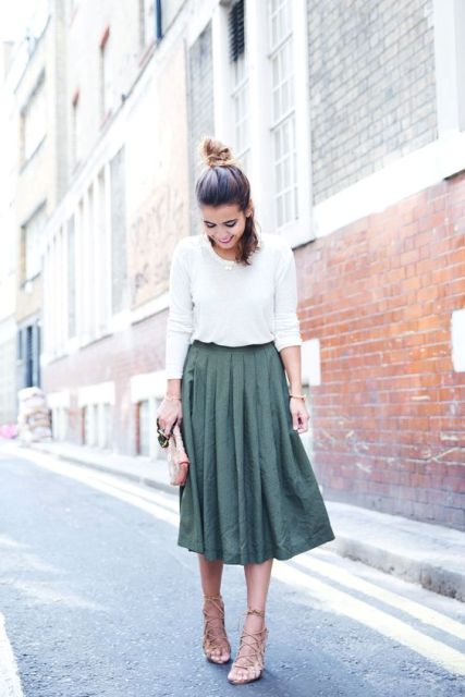 Chic look with white sweatshirt and midi A-line skirt