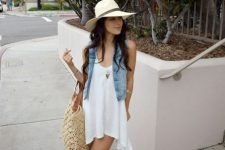 With loose dress and wide brim hat