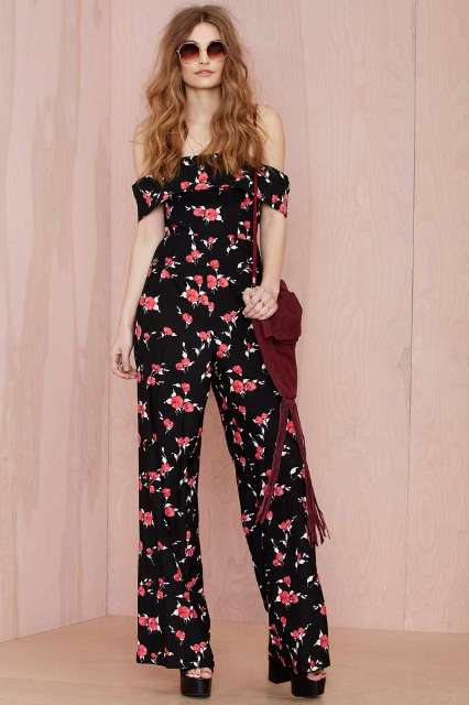 Floral jumpsuit with platform sandals and oversized sunglasses
