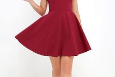 Look with deep red dress and lace up heels