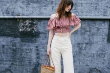 Trendy outfit with off the shoulder ruffle blouse, white jeans and bag
