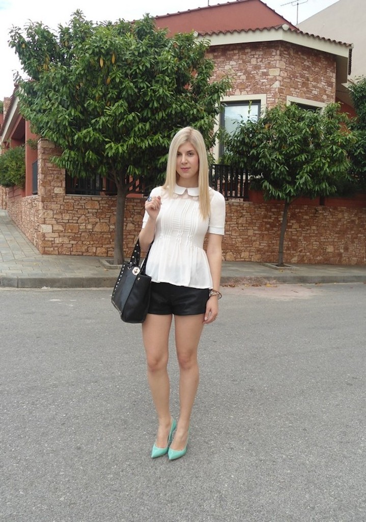 With black shorts and pastel color pumps