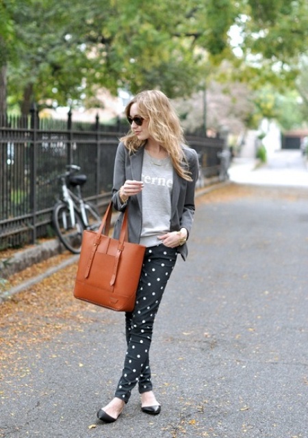 With gray jacket and big leather tote bag