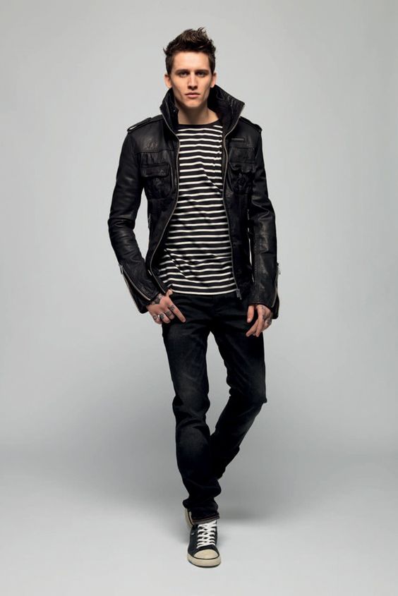 a striped jersey, jeans, a leather jacket and sneakers