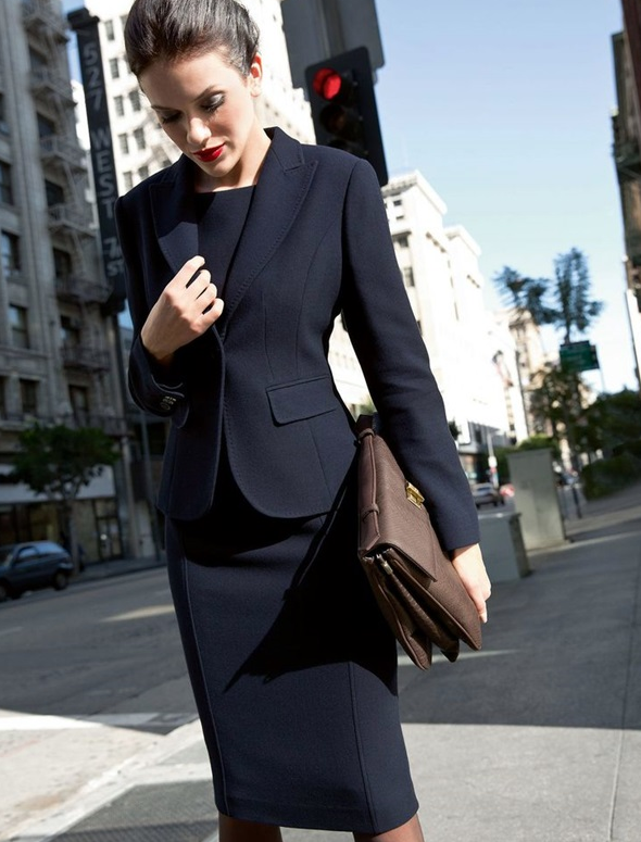 black suit with a skirt and a black top suits even the strictest dress code