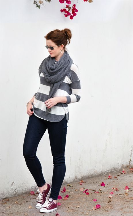 black jeans, a striped sweater, a grey scarf and oxblood Converse