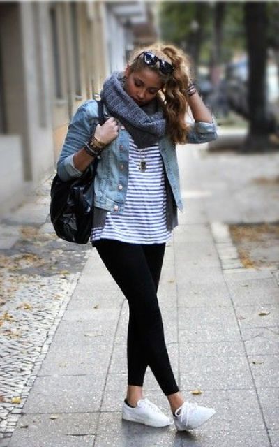black leggings, a striped tee, a denim jacket and white sneakers