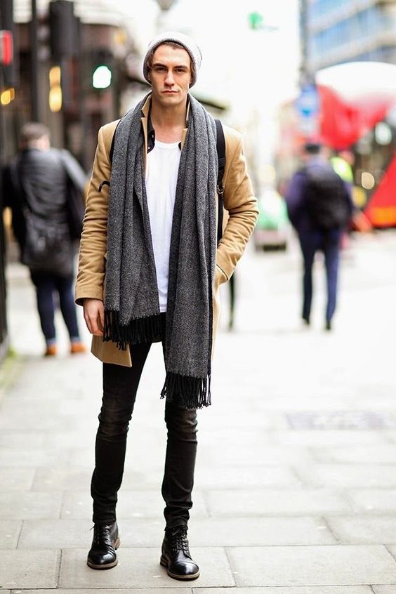 black jeans, a white tee, an ocher moto jacket and black boots