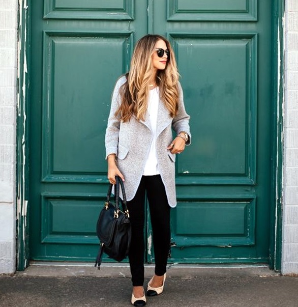 black jeans, a white top and a grey coat with flats
