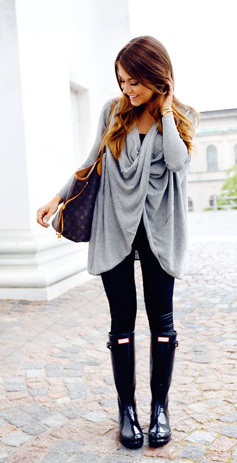 black leggings, a grey sweater and rain boots